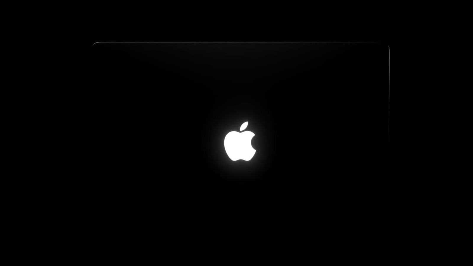 触屏 MacBook Pro 背盖中央亮起的 Apple 标志